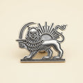 Silver-tone Shir-o-Khorshid brooch product shot on a cream background