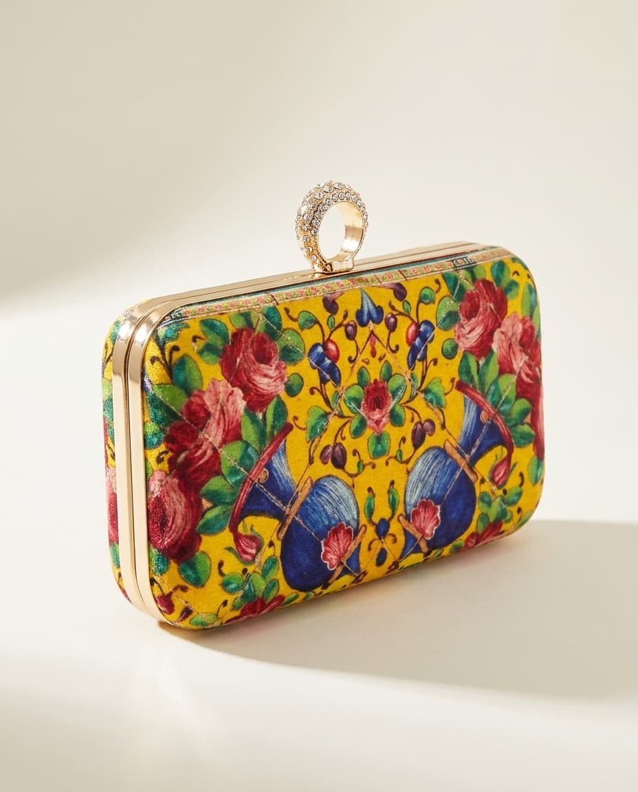 Yellow floral velvet box clutch on white