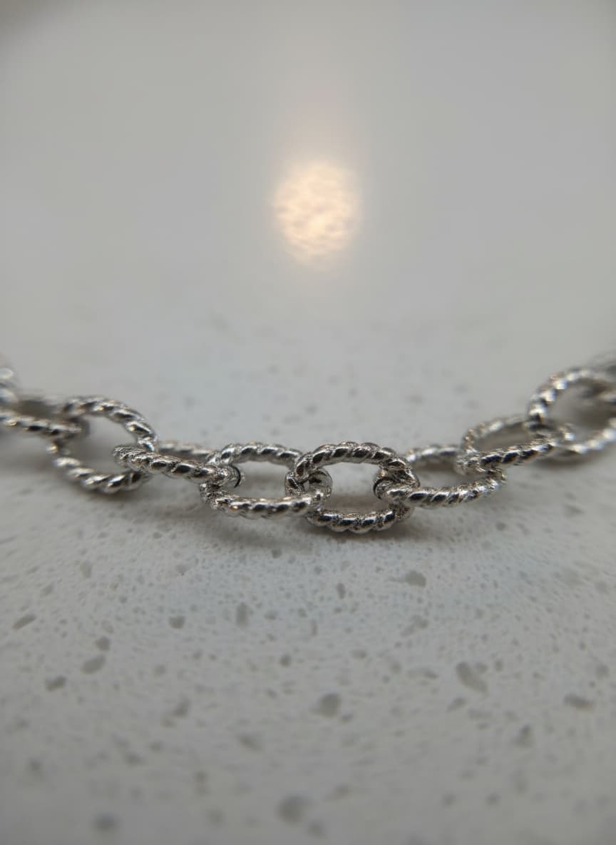 Macro close-up of the textured chain links