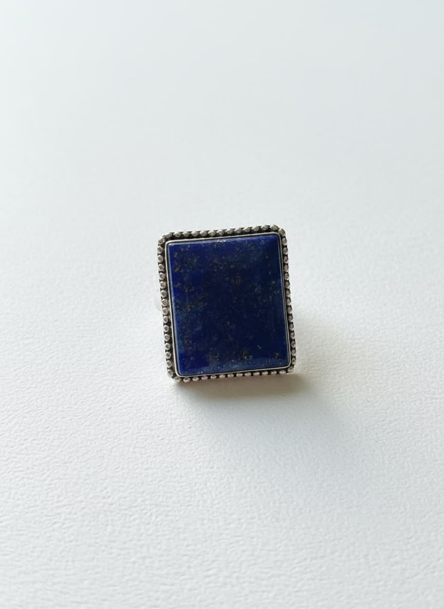 Silver-plated lapis lazuli ring on white