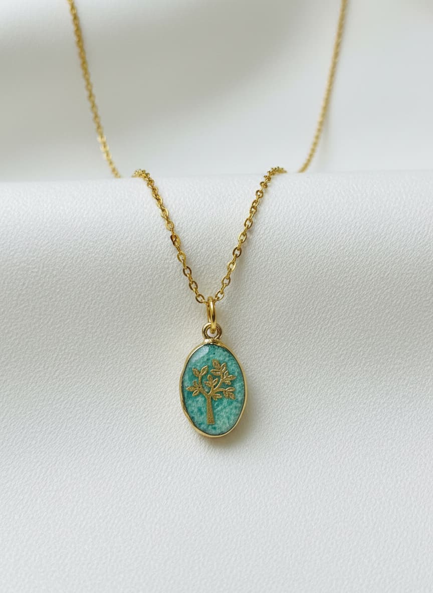 Green jade tree-of-life necklace on white