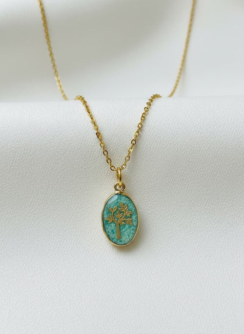 Green jade tree-of-life necklace on white