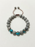 Turquoise and gray marbled bead bracelet on white