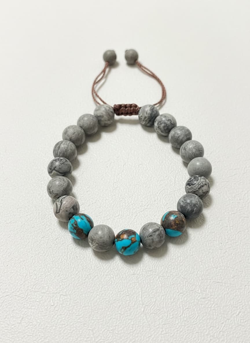 Turquoise and gray marbled bead bracelet on white