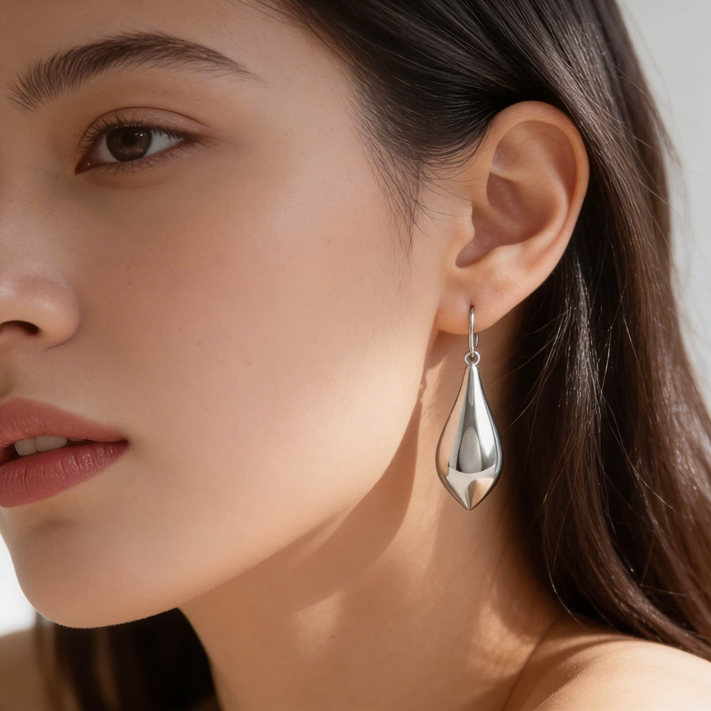 Model wearing the silver teardrop earring