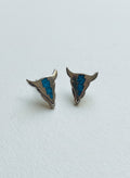 Silver-plated cow skull stud earrings with turquoise on white