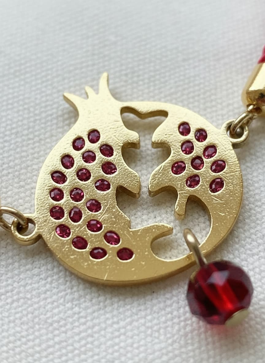 Macro close-up of the red pomegranate charm