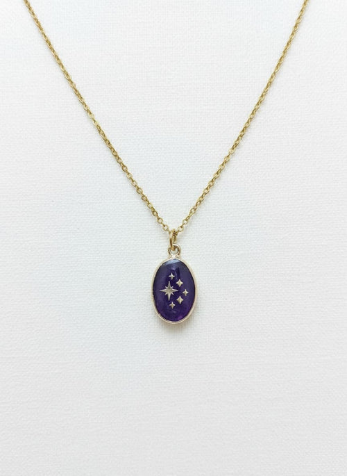 Gold necklace with purple amethyst star pendant
