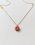 Gold-plated red enamel pomegranate slice pendant necklace on a delicate chain